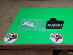 Genuine Suzuki Factory Racing 2" Hitch Cover Black White Red 990A0-19215. Fixed Price $15.74.