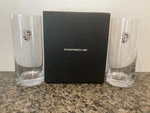 Design New & Unused, Boxed Pair Of Tall Drinking Glasses W/porsche Crest. Fixed Price $69.00.