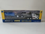 Newray Holland Agriculture White Kenworth W900 With Tractor Trailer. Fixed Price $34.99.