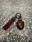 Brand New - Porsche Burgundy Keychain Ring Fob Holder Set Ships Fast. Fixed Price $14.95.